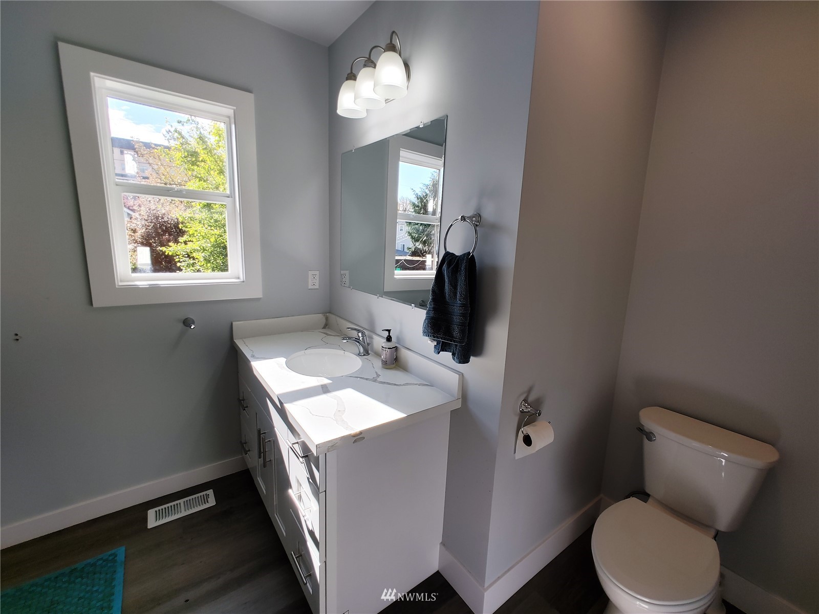 3506 Rockefeller Avenue Everett, WA 98201 - Photo 16 of 27 a bathroom with a toilet sink and mirror