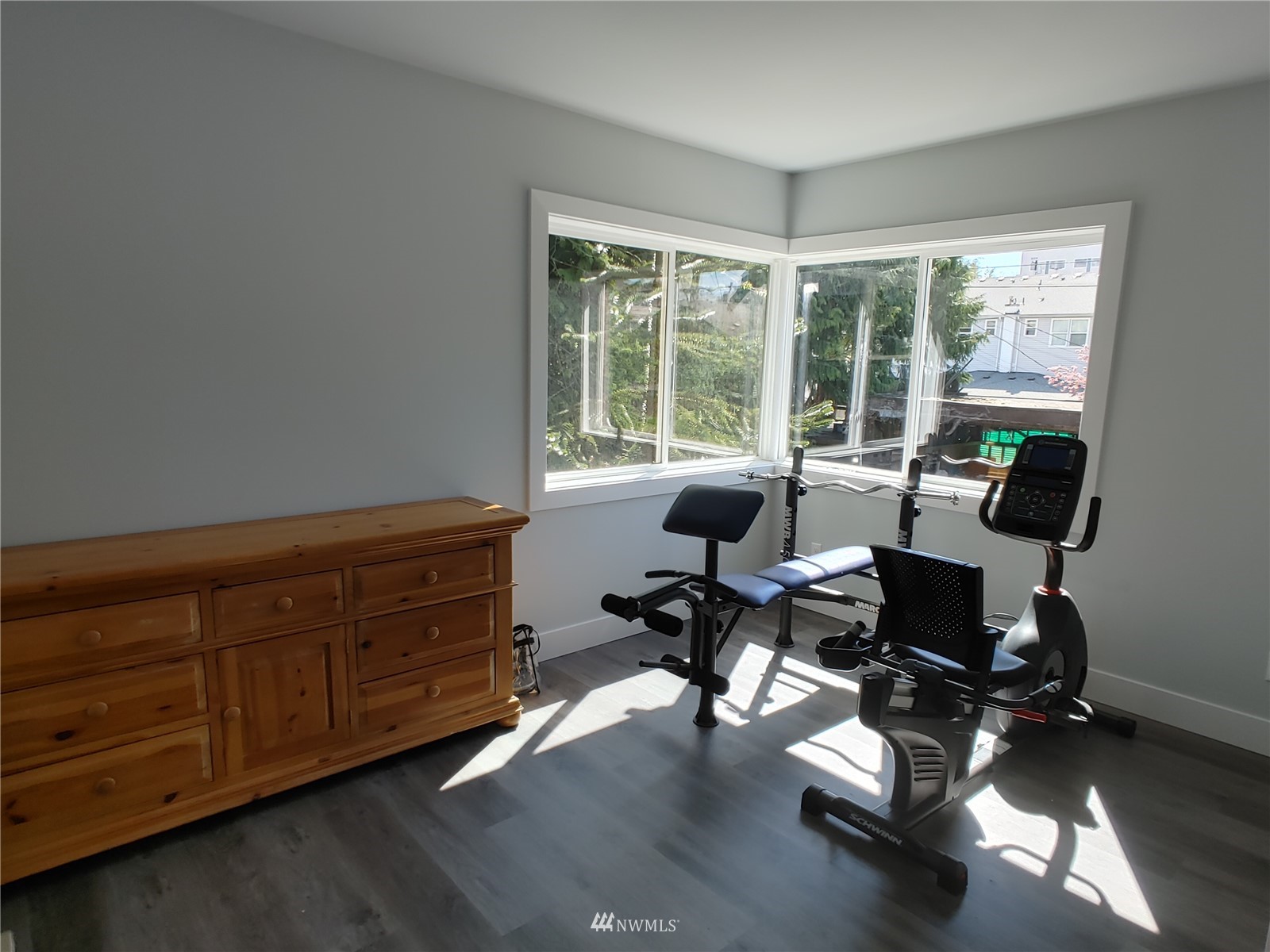 3506 Rockefeller Avenue Everett, WA 98201 - Photo 20 of 27 a view of workspace with wooden floor lounge chair and windows