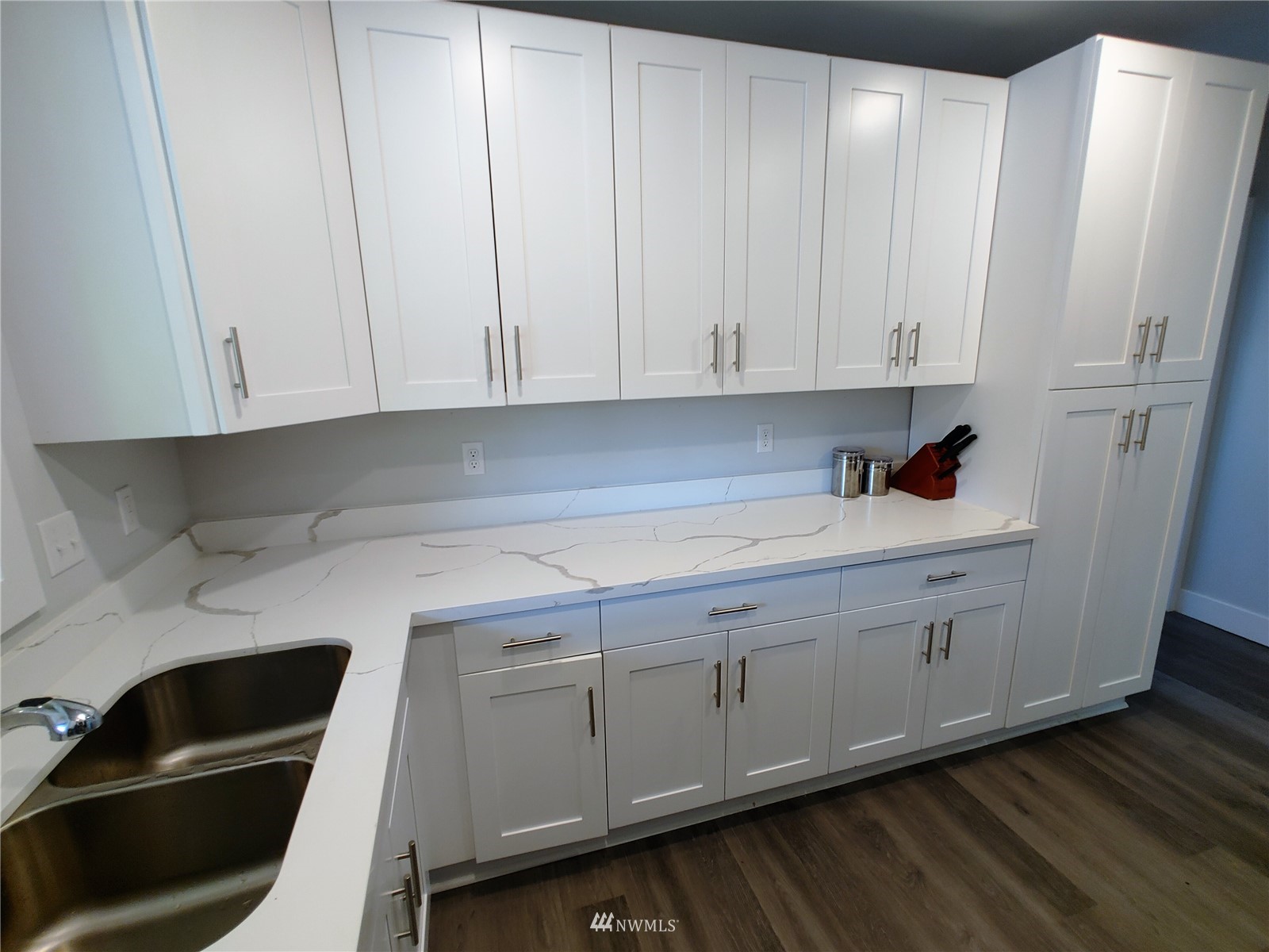 3506 Rockefeller Avenue Everett, WA 98201 - Photo 6 of 27 a kitchen with white cabinets and sink