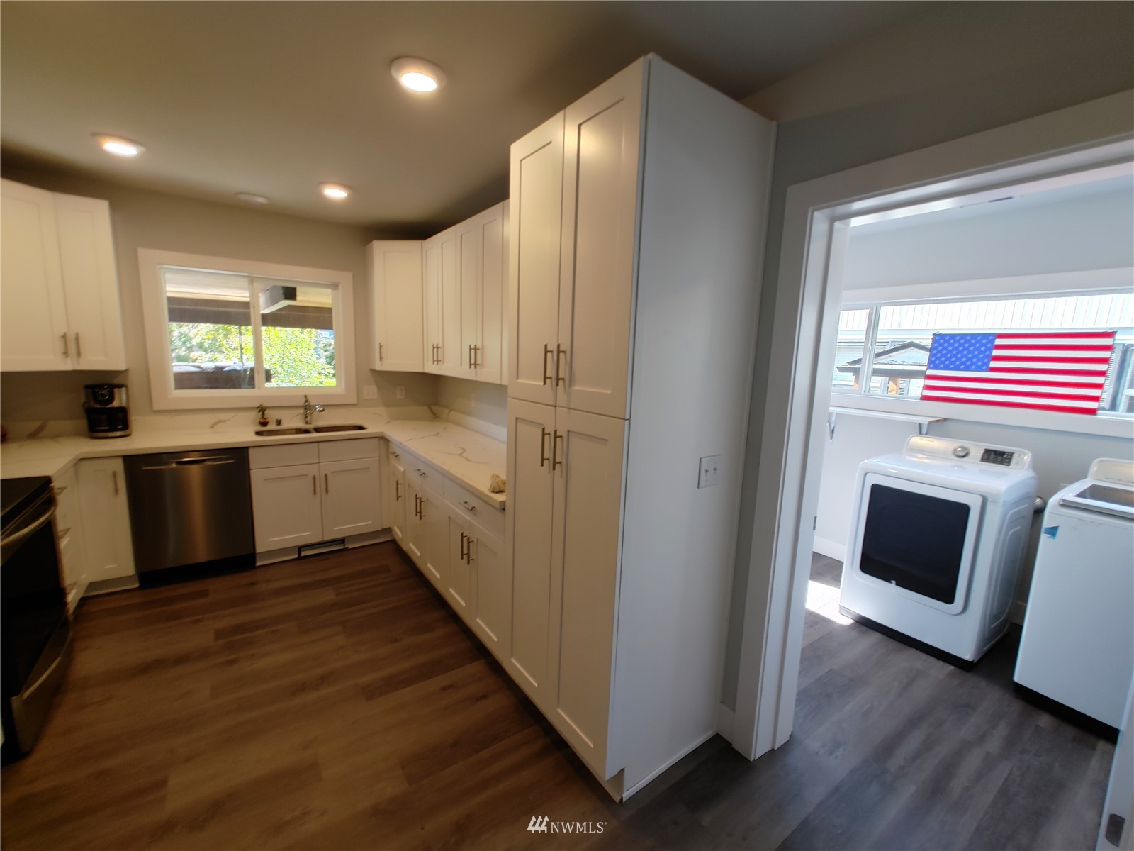 3506 Rockefeller Avenue Everett, WA 98201 - Photo 8 of 27 a kitchen with a sink window and stainless steel appliances