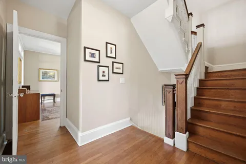 a view of entryway with wooden floor and stairs