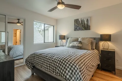 a bedroom with a bed and window