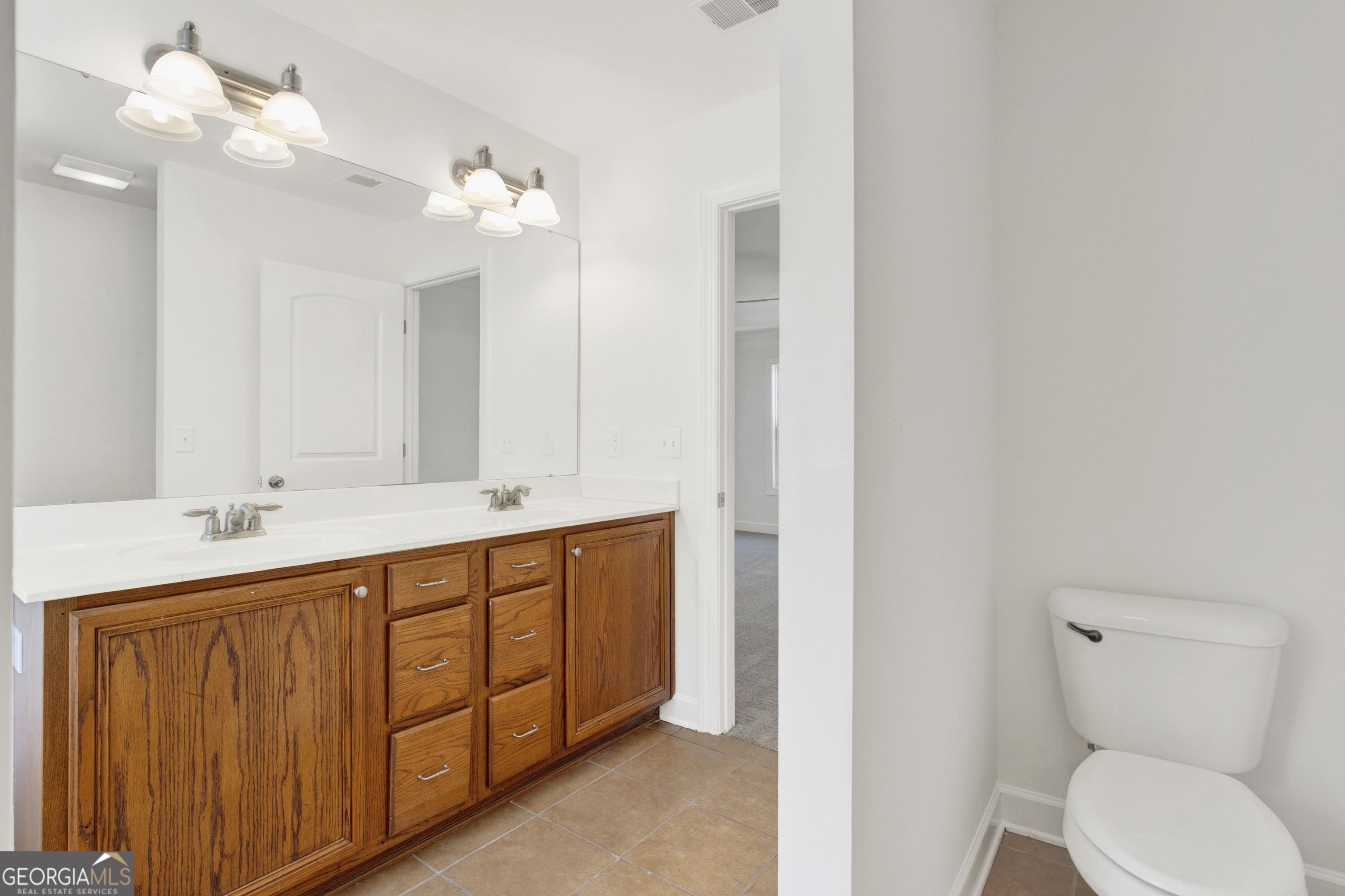 18 Stone Gate Court Pooler, GA 31322 - Photo 12 of 32 a spacious bathroom with a double vanity sink mirror and toilet