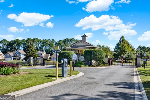 a view of a house with a swimming pool and a yard