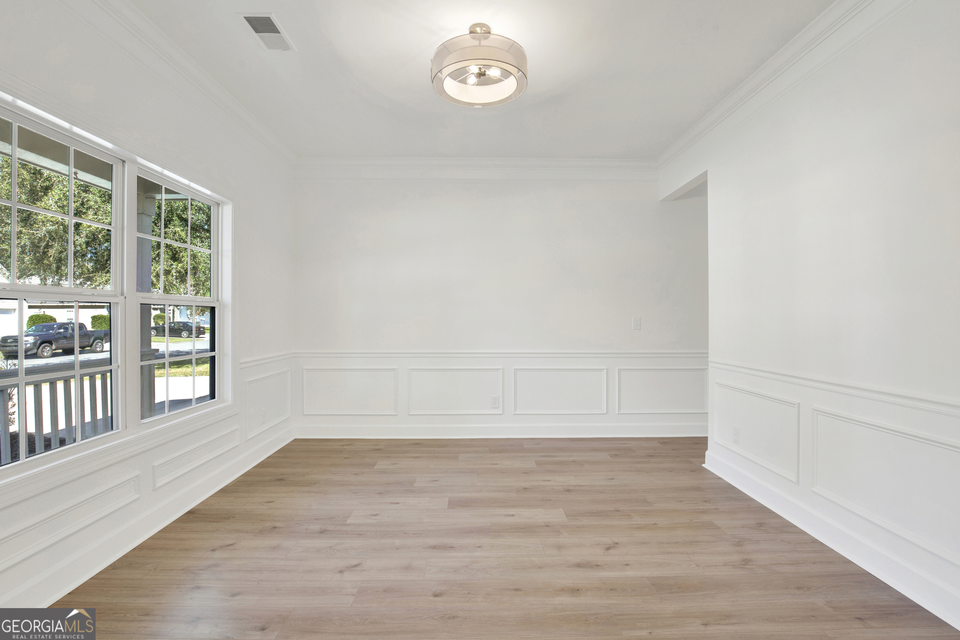18 Stone Gate Court Pooler, GA 31322 - Photo 8 of 32 a view of empty room with wooden floor and fan