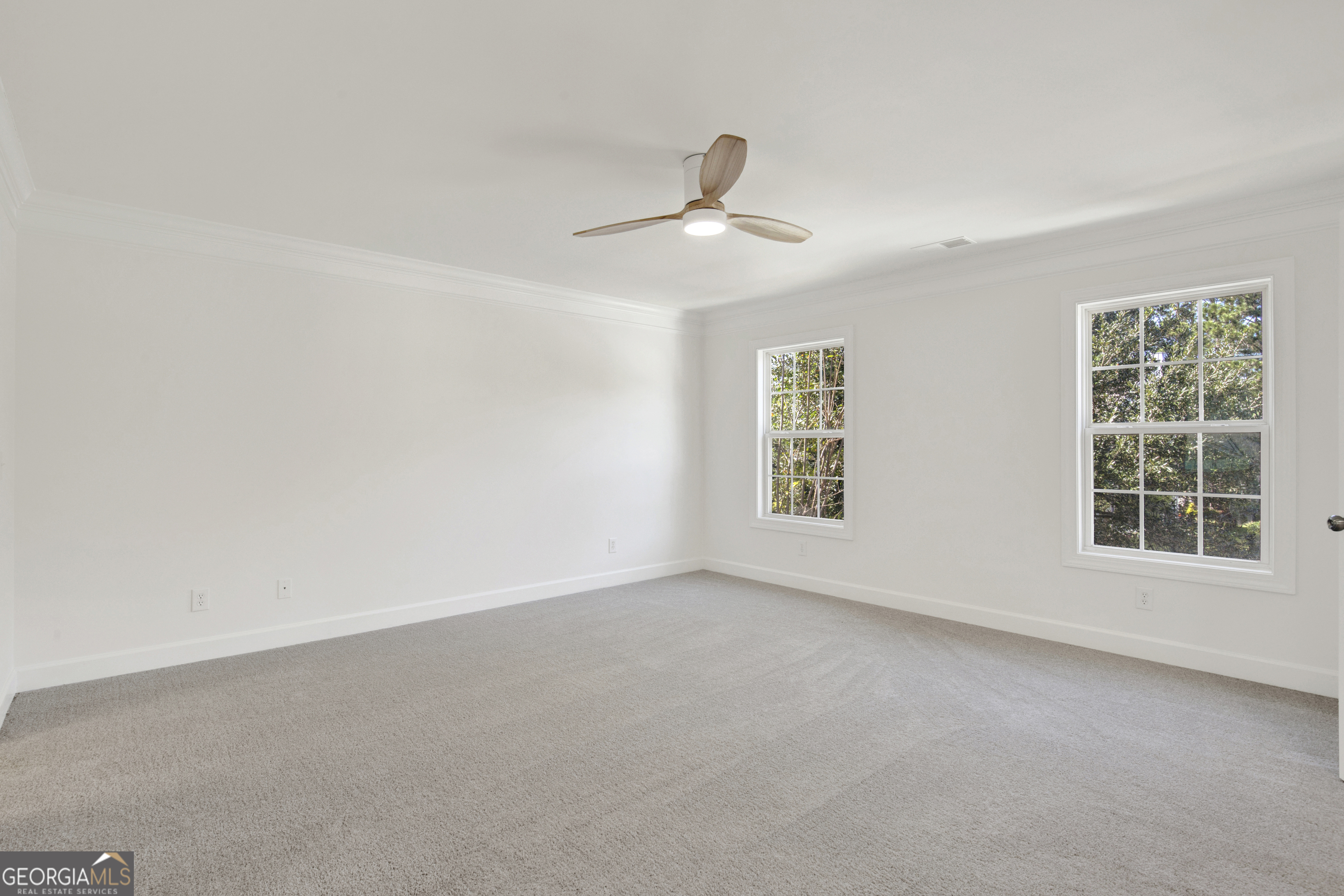 18 Stone Gate Court Pooler, GA 31322 - Photo 9 of 32 an empty room with a window and a ceiling fan