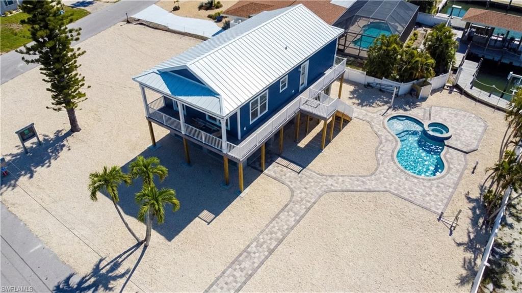 1 Fairview Boulevard Fort Myers Beach, FL 33931 - Photo 48 of 48 an aerial view of a house with swimming pool and patio