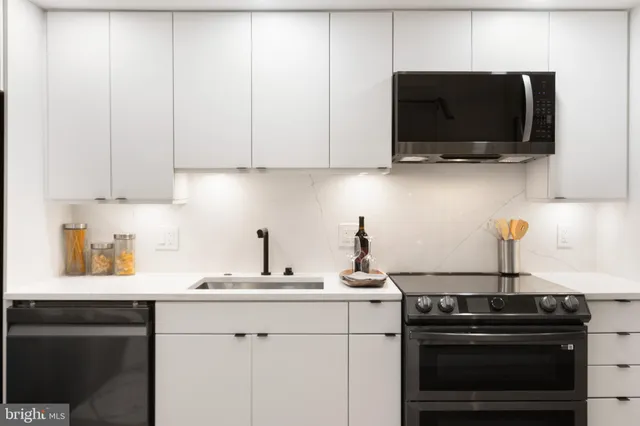 a bedroom with a bed and a view of bathroom