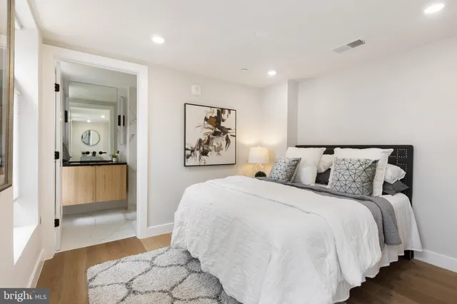 a bedroom with a bed and lamp