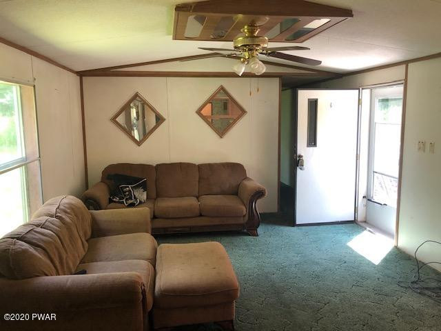 213 Slish Road Honesdale, PA 18431 - Photo 6 of 13 a living room with furniture and a window