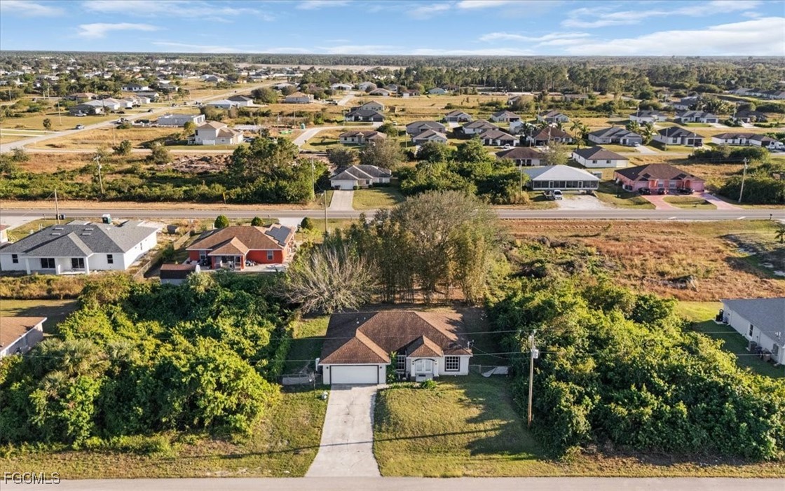 234 Pullman Street Lehigh Acres, FL 33974 - Photo 5 of 50 an aerial view of residential houses with outdoor space