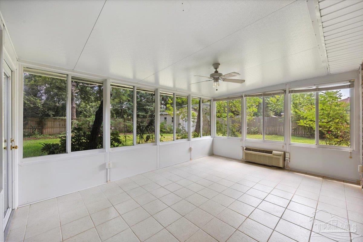 3485 Ashmore Lane Pace, FL 32571 - Photo 22 of 49 a view of an empty room with windows and city view