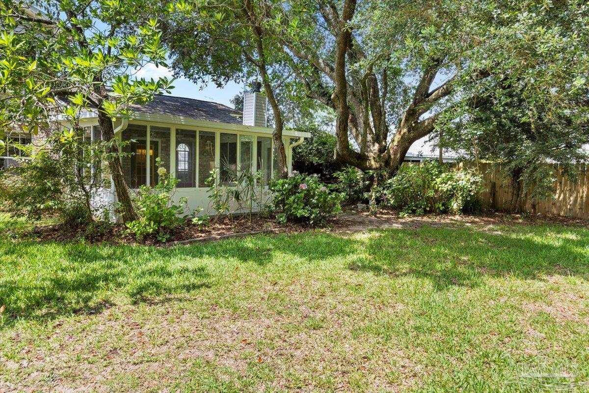 3485 Ashmore Lane Pace, FL 32571 - Photo 28 of 49 a view of house with a yard