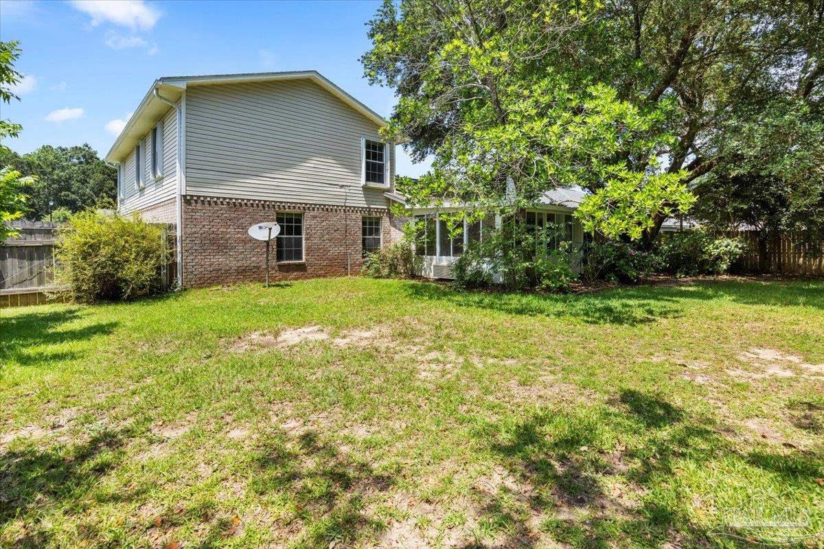 3485 Ashmore Lane Pace, FL 32571 - Photo 29 of 49 a view of a house with a yard
