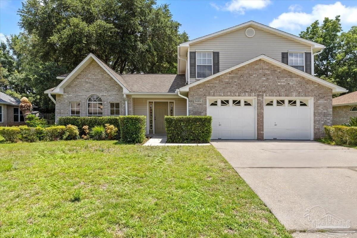 3485 Ashmore Lane Pace, FL 32571 - Photo 3 of 49 a view of a house with a yard and large tree