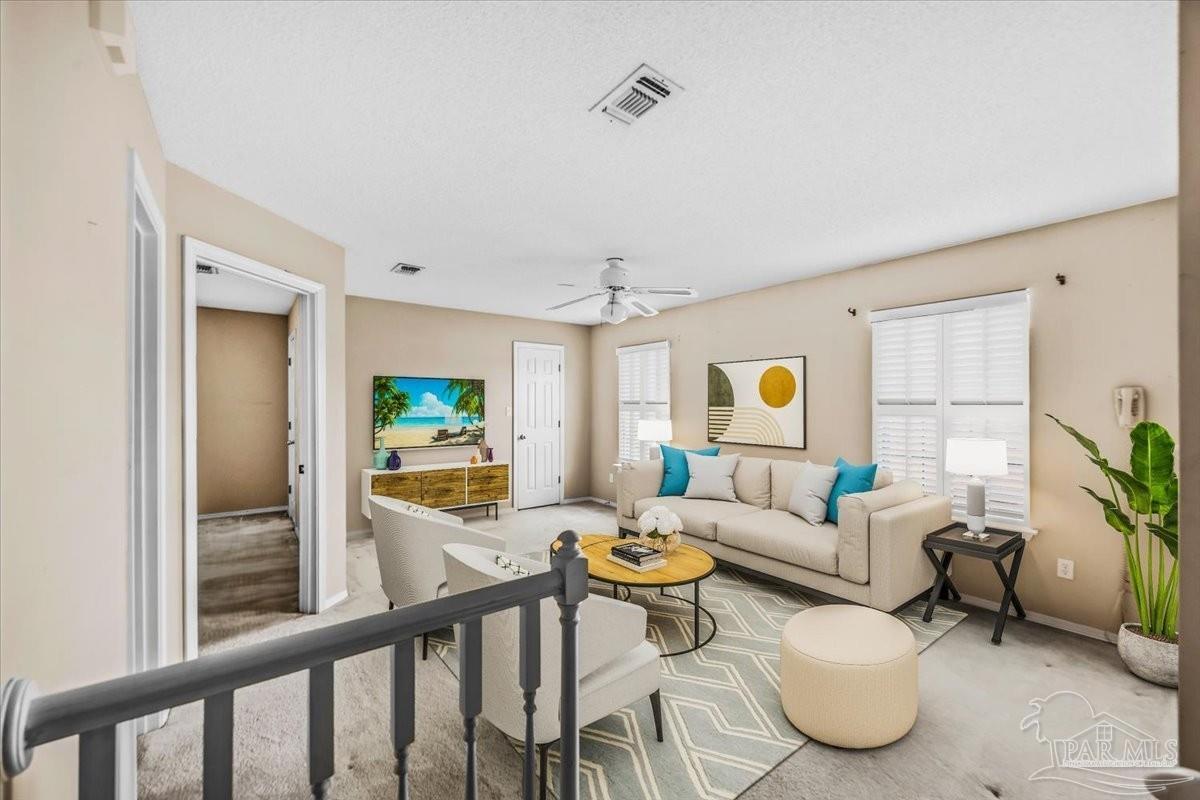 3485 Ashmore Lane Pace, FL 32571 - Photo 36 of 49 a living room with furniture and a flat screen tv