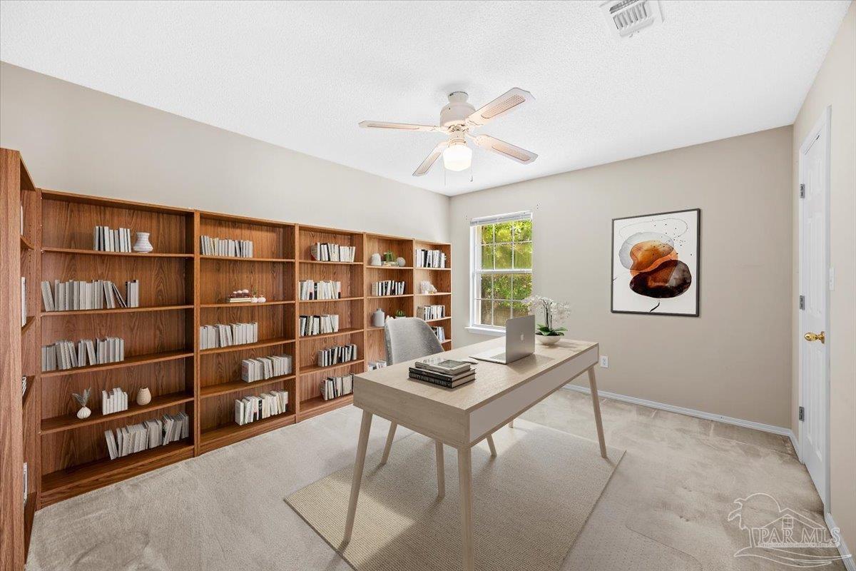 3485 Ashmore Lane Pace, FL 32571 - Photo 39 of 49 a workspace with a bookshelf