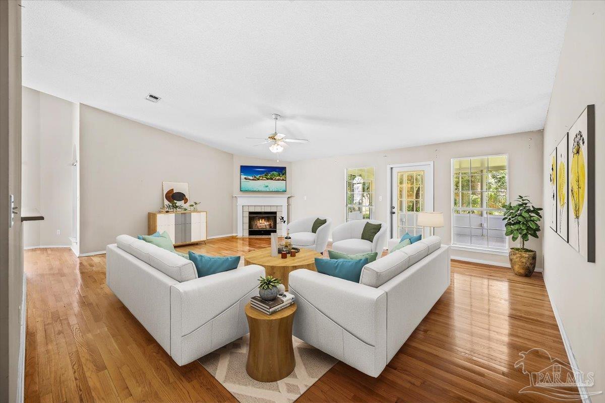 3485 Ashmore Lane Pace, FL 32571 - Photo 8 of 49 a living room with furniture and a wooden floor
