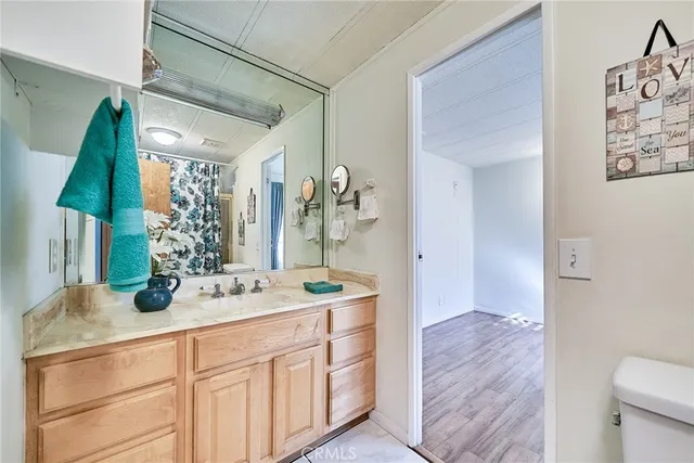 a bathroom with a double vanity sink and a mirror