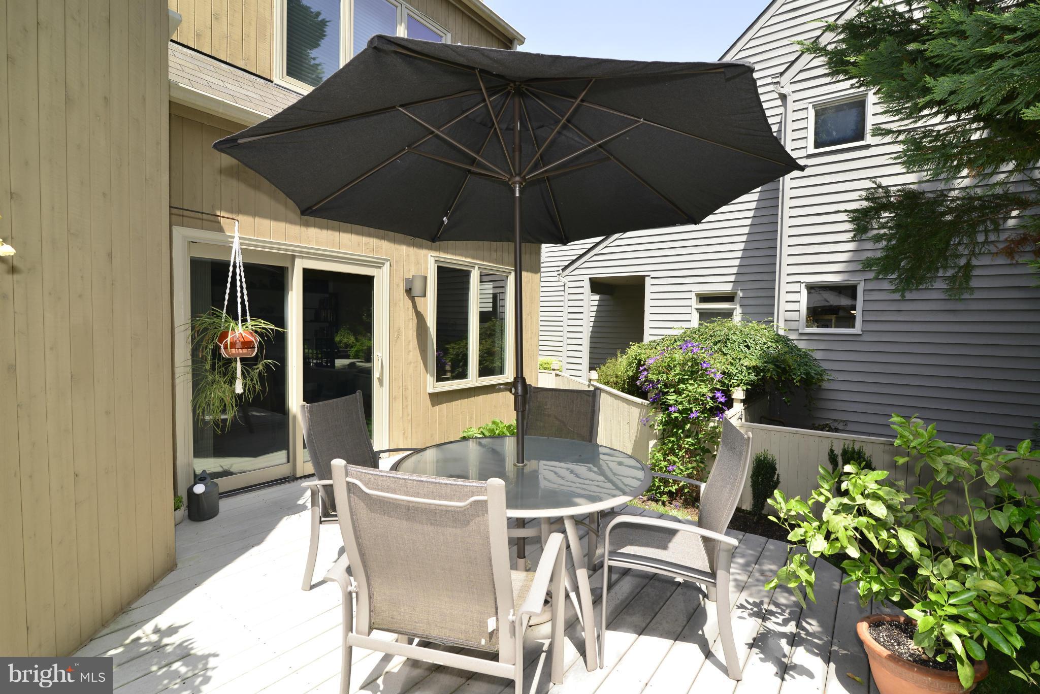 2015 Beacon Place Reston, VA 20191 - Photo 8 of 22 a view of a patio with table and chairs potted plants