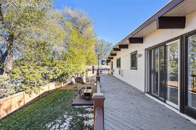 a view of a house with backyard porch and sitting area