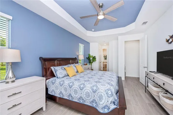 a view of a livingroom with furniture and a floor to ceiling window