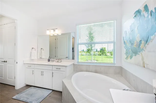 a view of a house with yard and sitting area