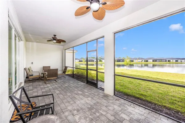 a view of a room with gym equipment and a large window