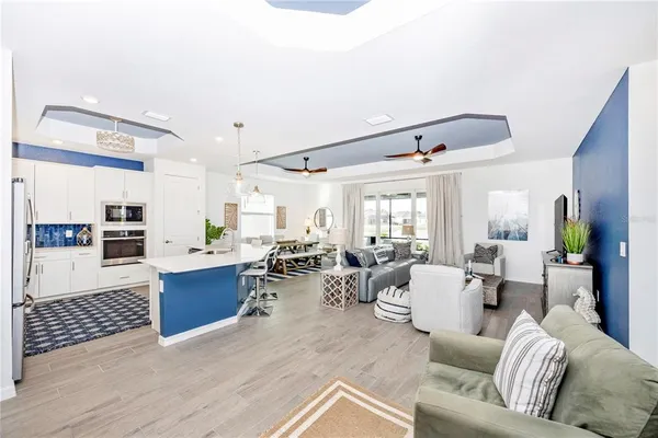 a kitchen with a sink stainless steel appliances and cabinets