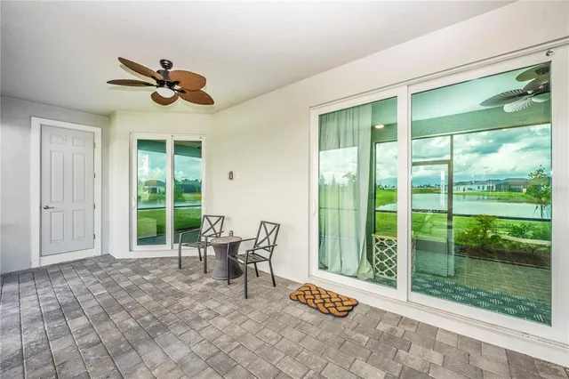 a living room with lots of furniture and a chandelier