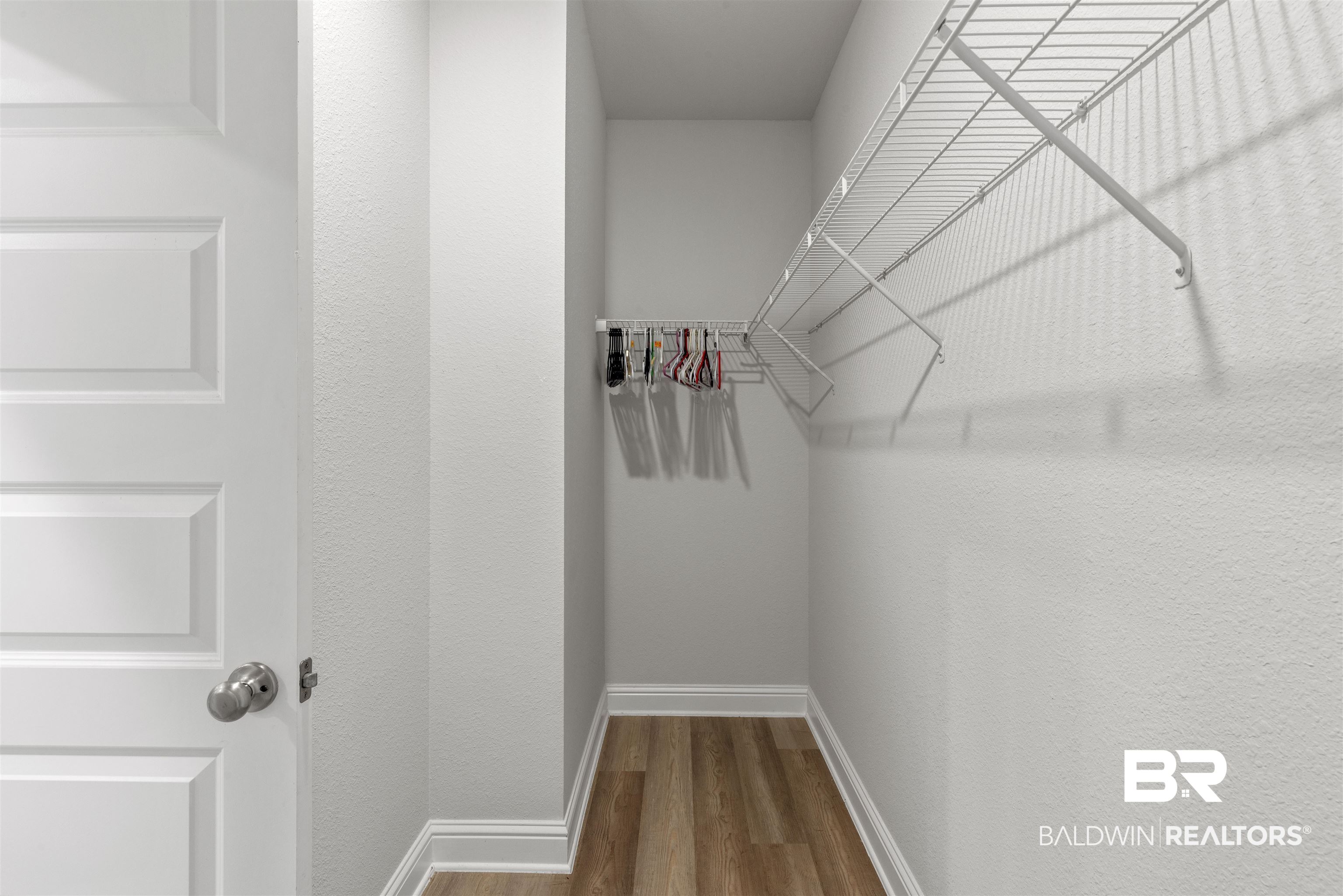 485 Shepard Street Gulf Shores, AL 36542 - Photo 24 of 53 Walk in closet with dark wood-style flooring