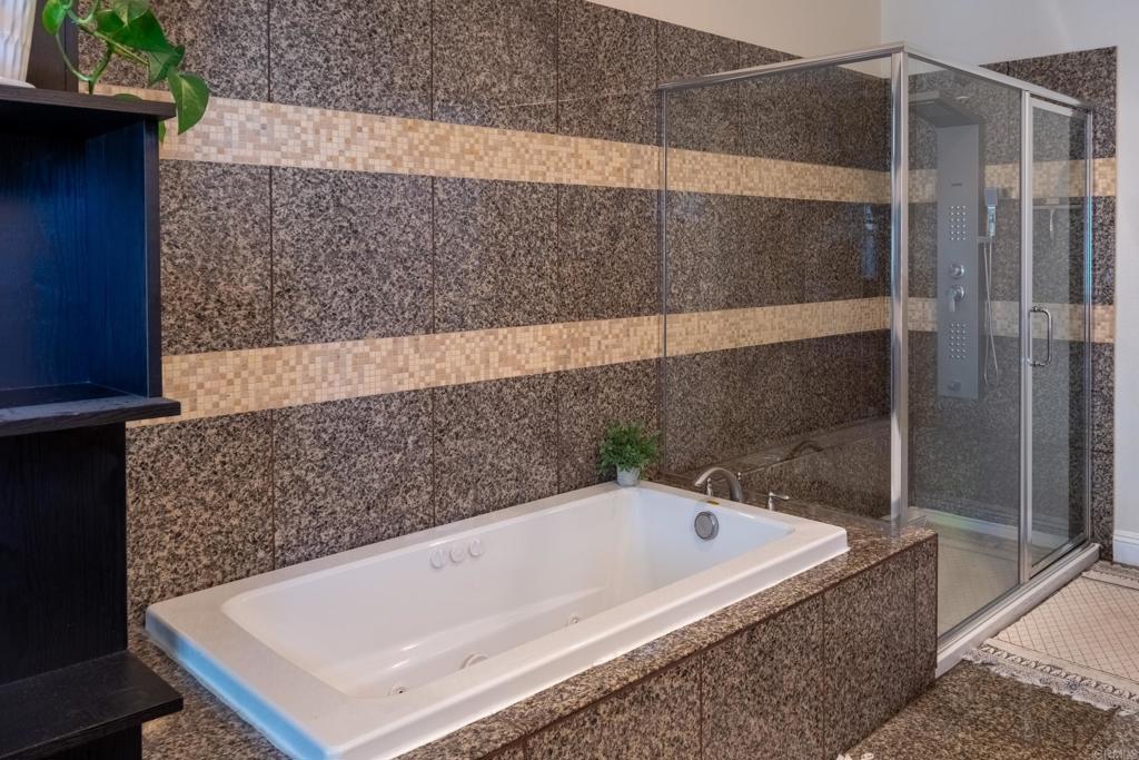 1657 Coronado Avenue Spring Valley, CA 91977 - Photo 19 of 46 a bathroom with a bathtub and shower