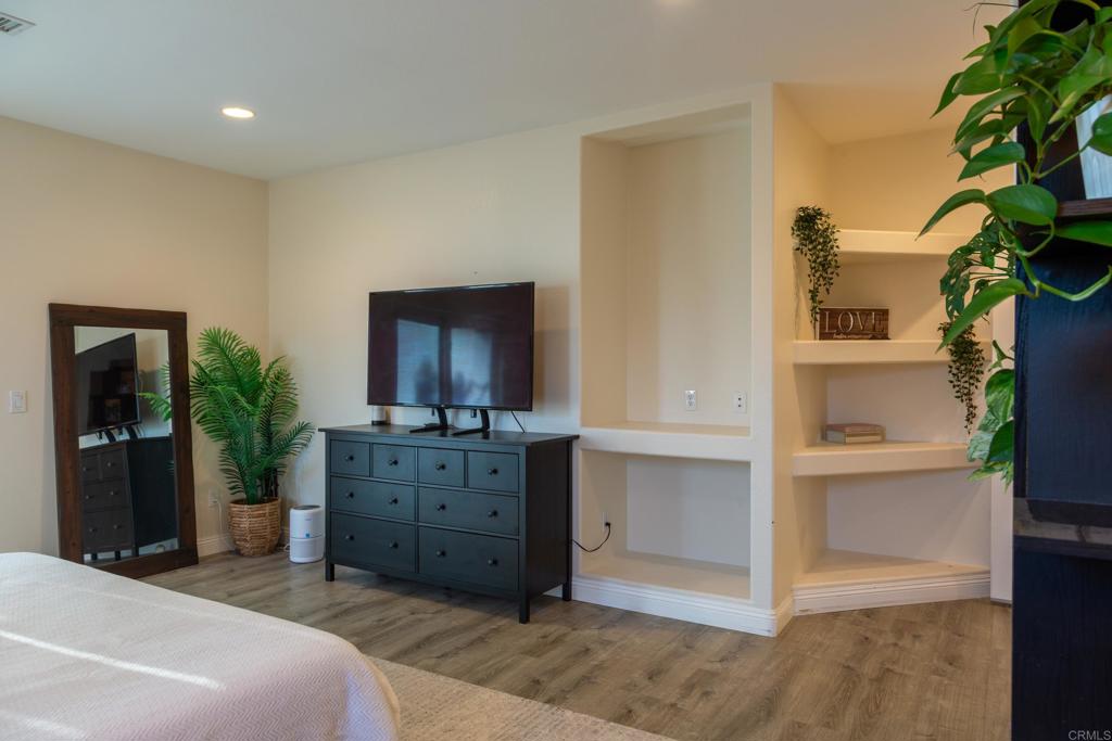 1657 Coronado Avenue Spring Valley, CA 91977 - Photo 20 of 46 a spacious bedroom with a bed and a cabinets