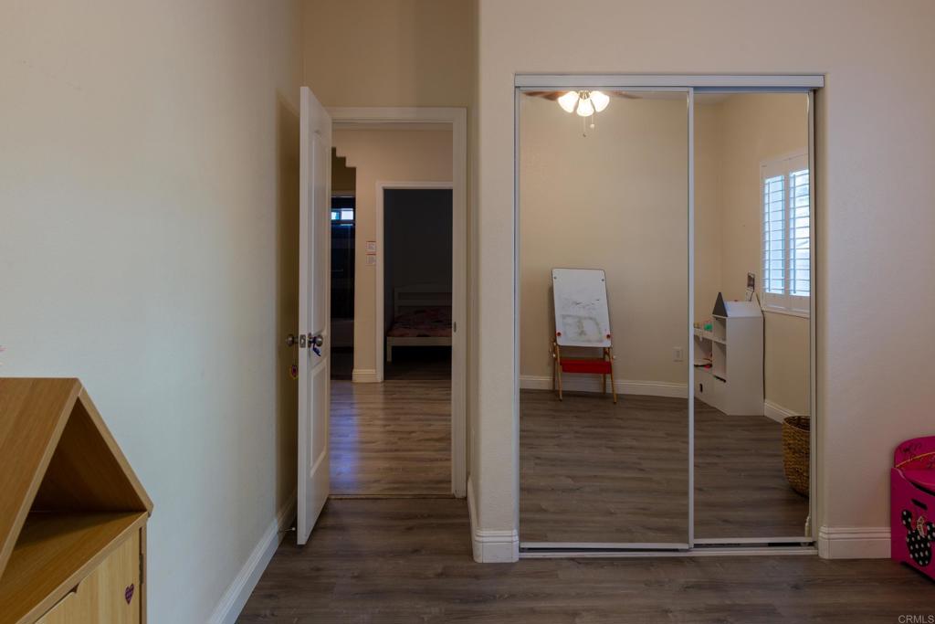 1657 Coronado Avenue Spring Valley, CA 91977 - Photo 24 of 46 a view of a hallway with wooden floor and staircase