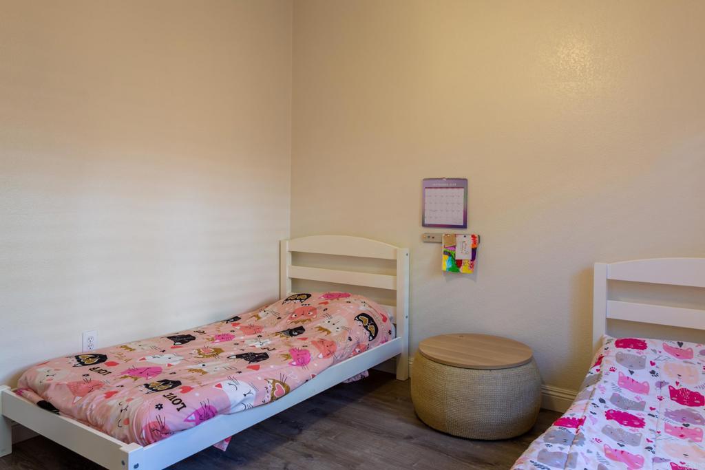 1657 Coronado Avenue Spring Valley, CA 91977 - Photo 25 of 46 a bedroom with a bed and a lamp on the dresser