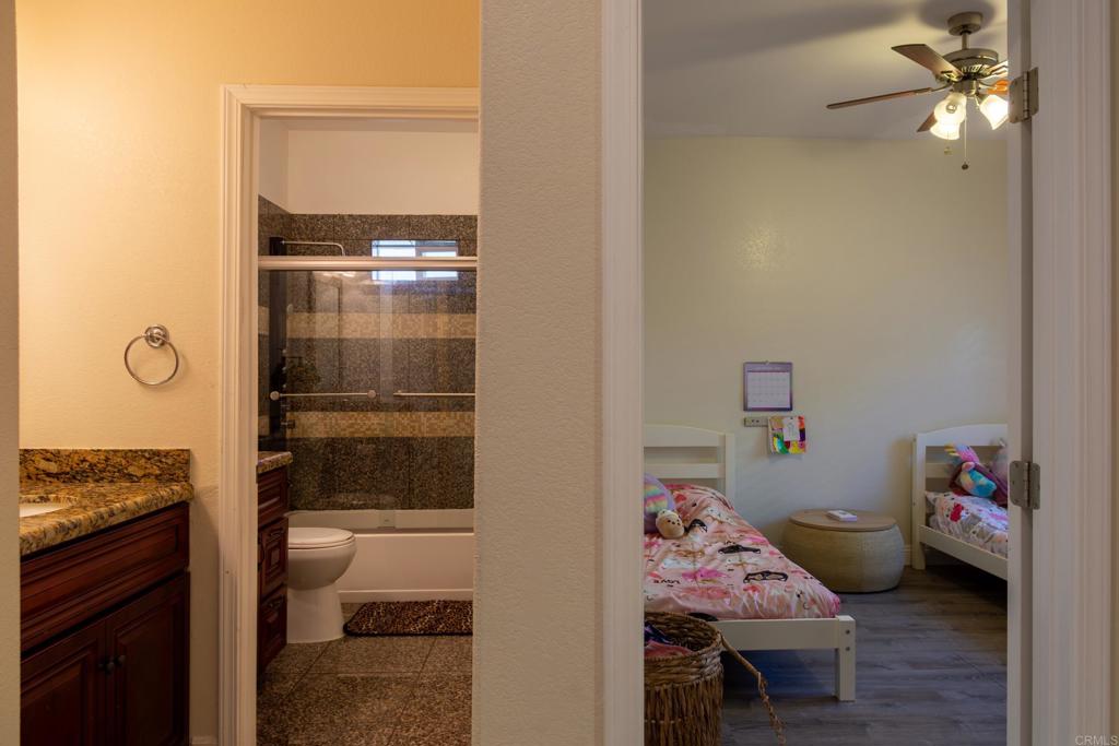 1657 Coronado Avenue Spring Valley, CA 91977 - Photo 27 of 46 a bedroom with a bed and furniture