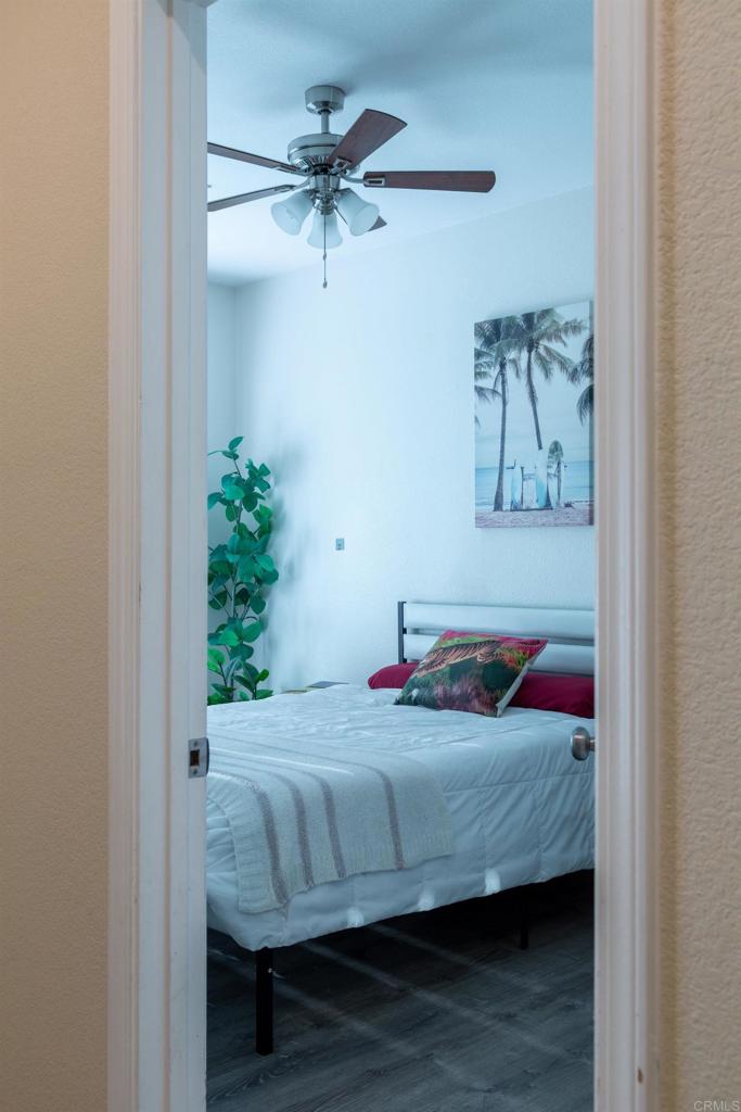 1657 Coronado Avenue Spring Valley, CA 91977 - Photo 30 of 46 a bedroom with a bed and a potted plant
