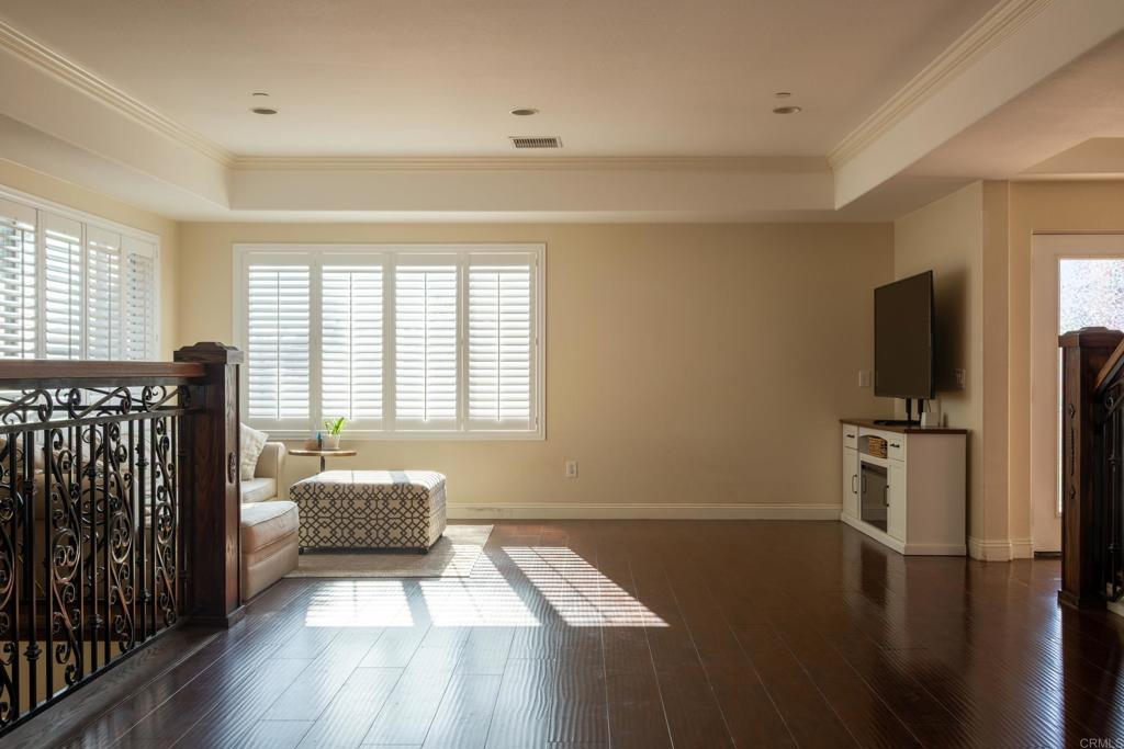 1657 Coronado Avenue Spring Valley, CA 91977 - Photo 6 of 46 a view of a room with wooden floor and a window