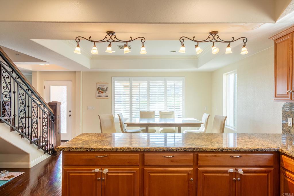 1657 Coronado Avenue Spring Valley, CA 91977 - Photo 10 of 46 a kitchen with granite countertop a stove and cabinets