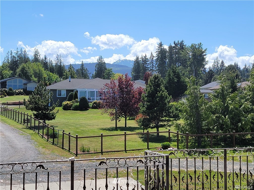 113 Les Saints Road Sequim, WA 98382 - Photo 1 of 1 a view of a park with iron fence