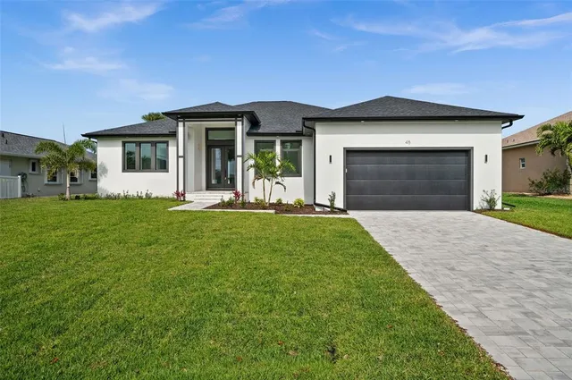 a front view of a house with a yard and porch