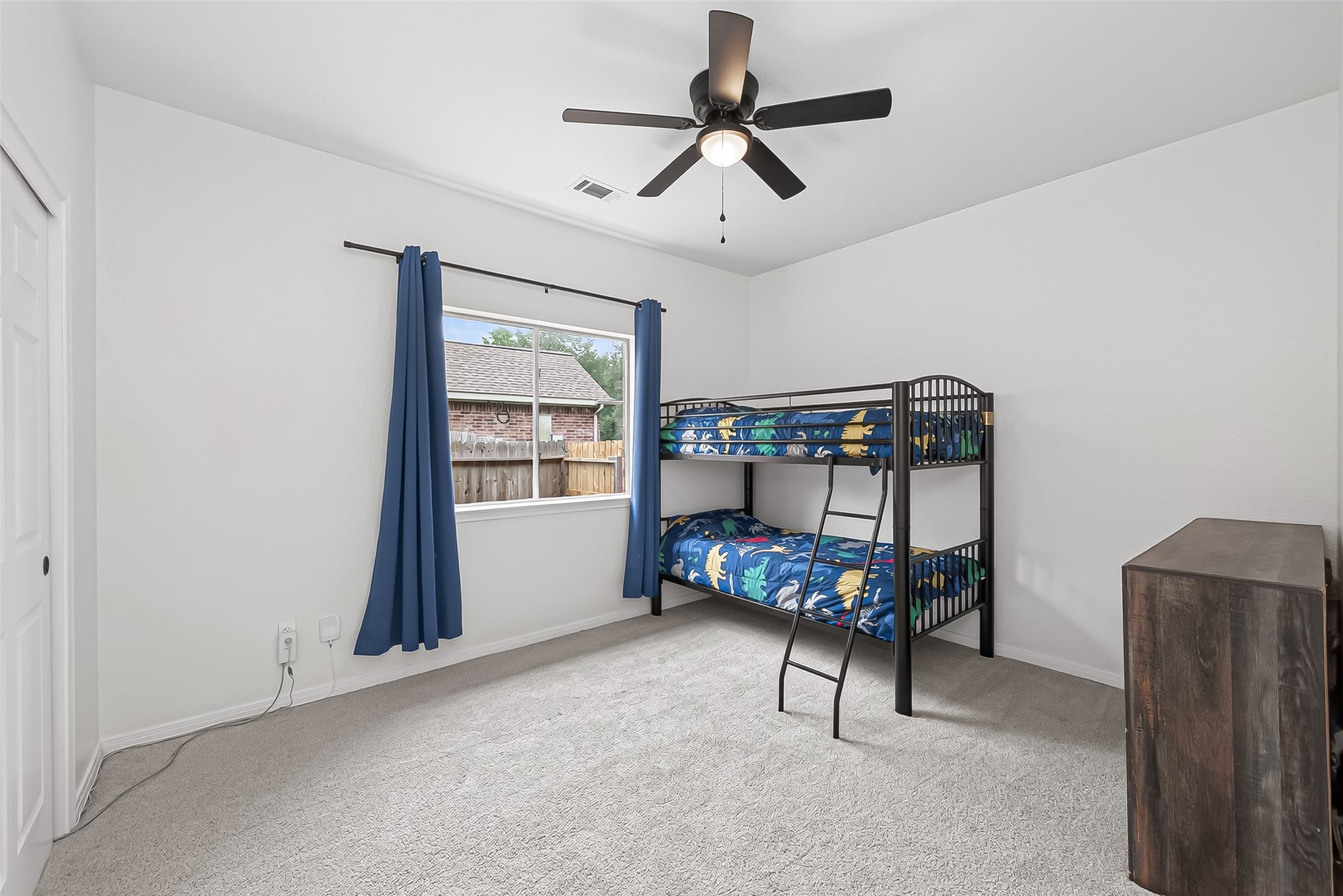 7411 Stonesfield Place Spring, TX 77389 - Photo 23 of 43 1st Floor - Jr. Primary Bedroom - This is a rare find. This home has a Jr. primary on the first floor. Currently being used a bedroom for children but could be used for a parent, guest, or nursery.High efficiency ceiling fans installed for maximum airflow and lower energy consumption.
