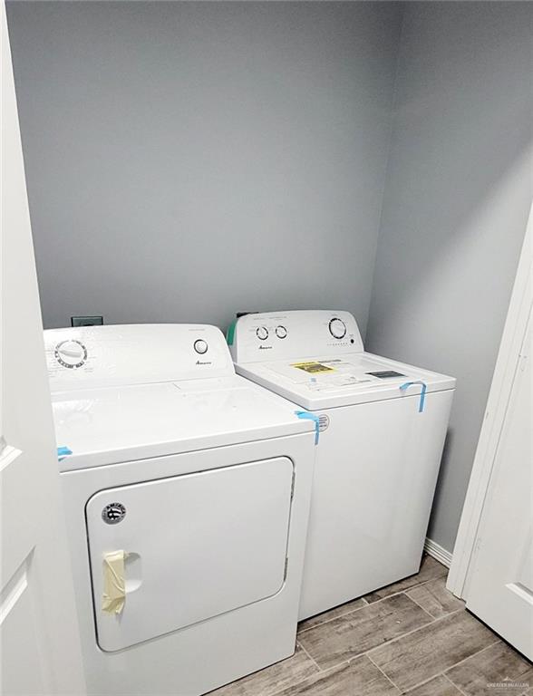 2808 Rosemary Drive, Unit 1 Weslaco, TX 78599 - Photo 13 of 13 a utility room with dryer and washer