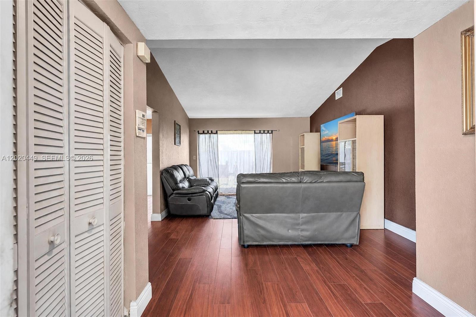 11061 Southwest 163rd Street Miami, FL 33157 - Photo 12 of 42 a living room with furniture and a wooden floor