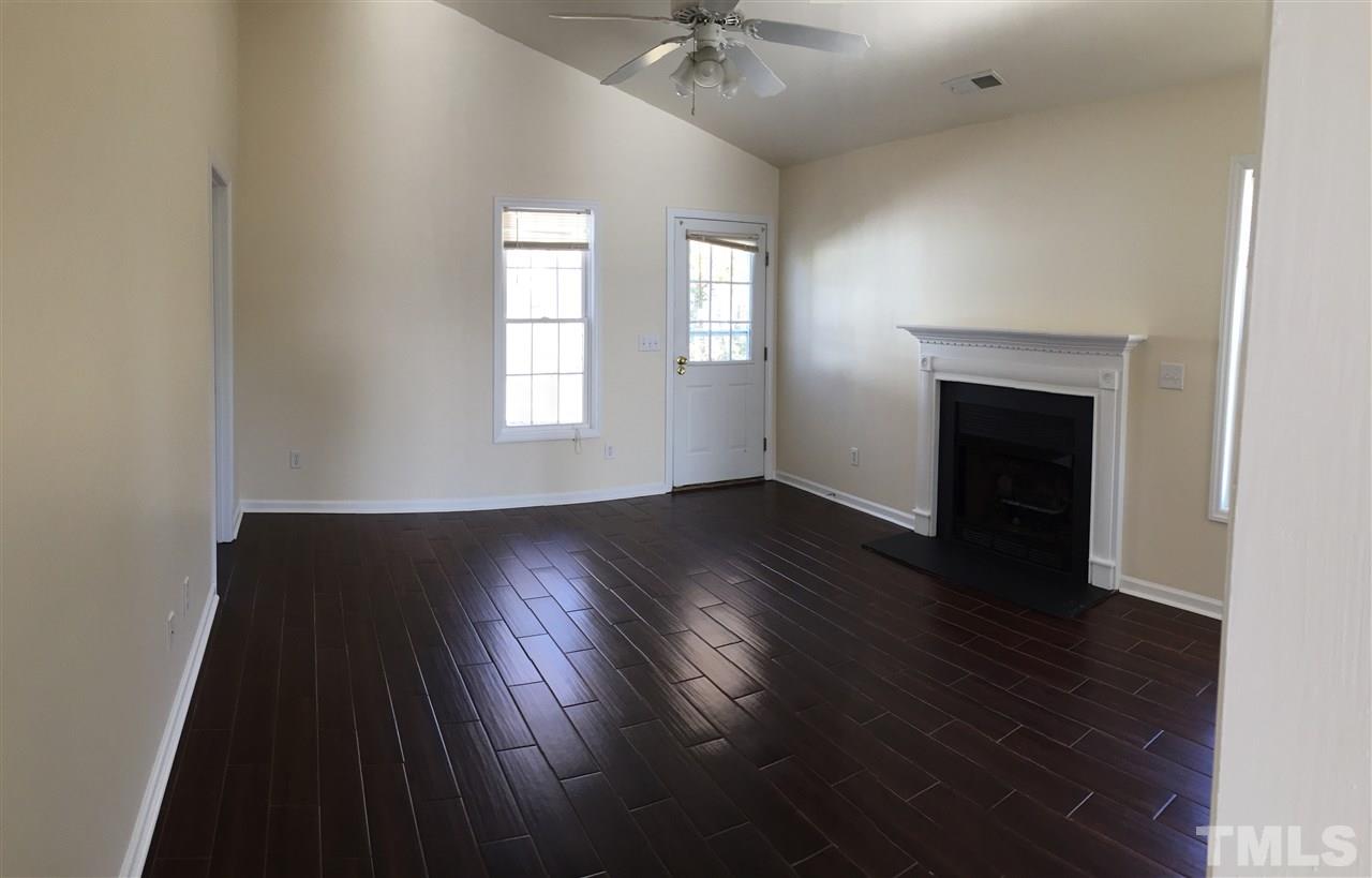 5405 Advantis Drive Raleigh, NC 27610 - Photo 7 of 16 wooden floor in an empty room with a window