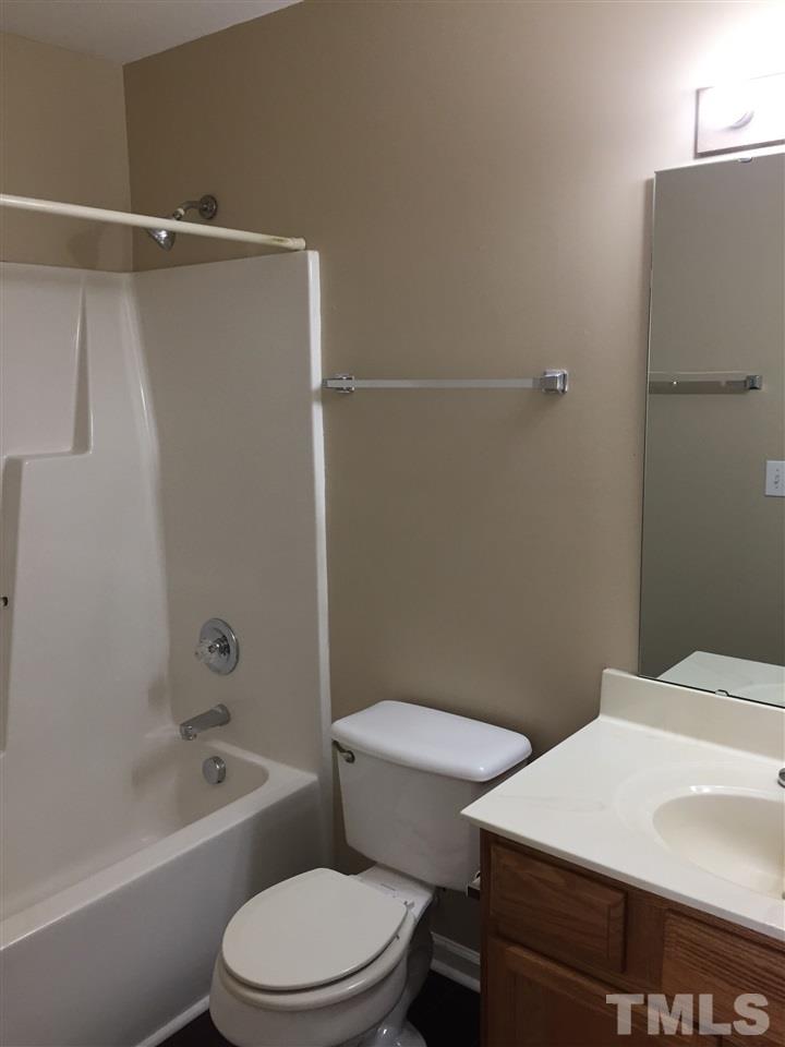 5405 Advantis Drive Raleigh, NC 27610 - Photo 9 of 16 a bathroom with a toilet a sink and shower