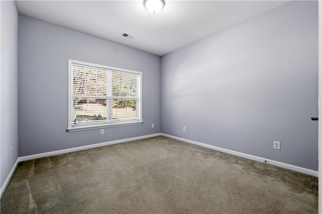 2310 Callaway Court Cumming, GA 30041 - Photo 14 of 30 an empty room with windows