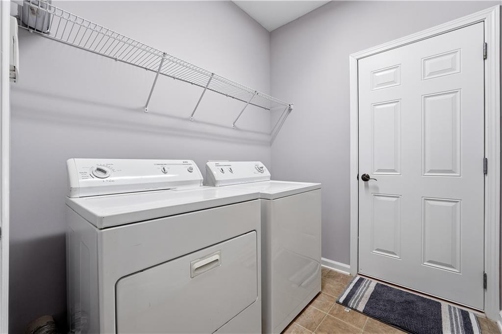 2310 Callaway Court Cumming, GA 30041 - Photo 21 of 30 a utility room with dryer and washer