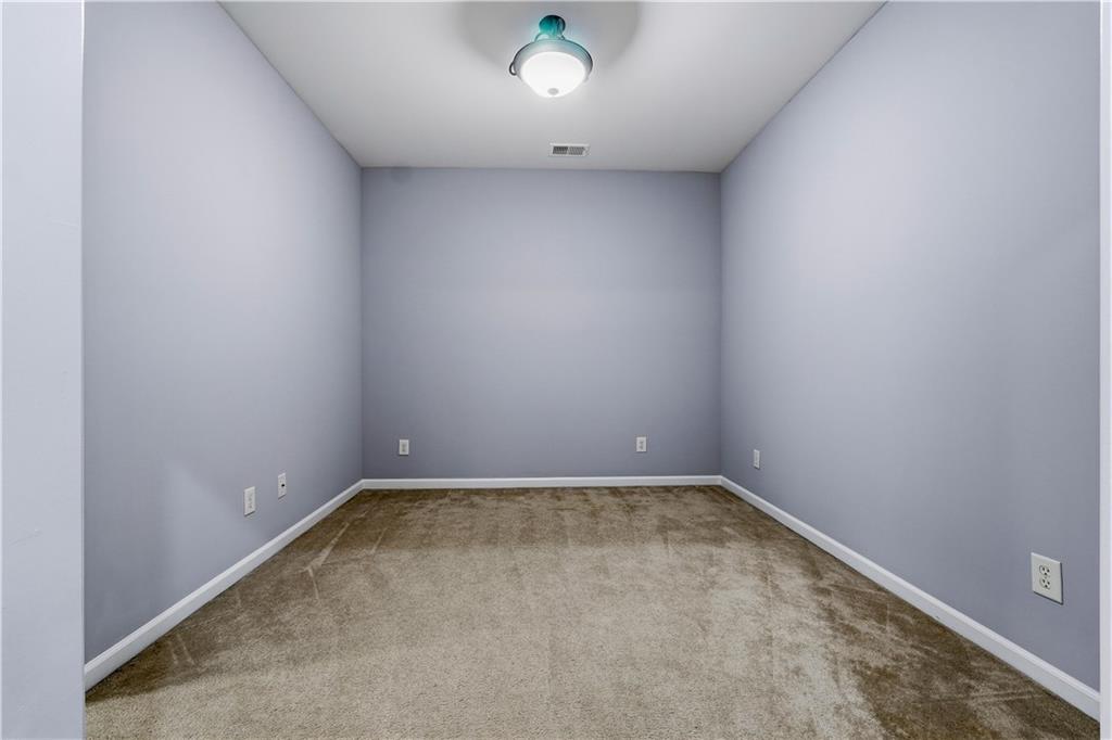 2310 Callaway Court Cumming, GA 30041 - Photo 22 of 30 an empty room with a window