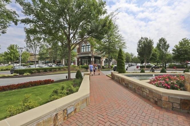 2310 Callaway Court Cumming, GA 30041 - Photo 27 of 30 a view of a swimming pool with a patio